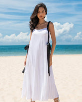 Flowy pleated silk dress with wide shoulder straps and bow-tie accents